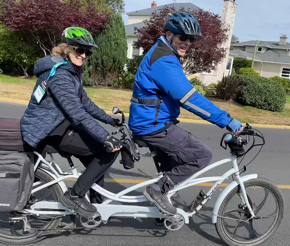 Pedego-Canada---Tandem---Jean-and-Aurthur A couple rides their white Pedego tandem electric bike.