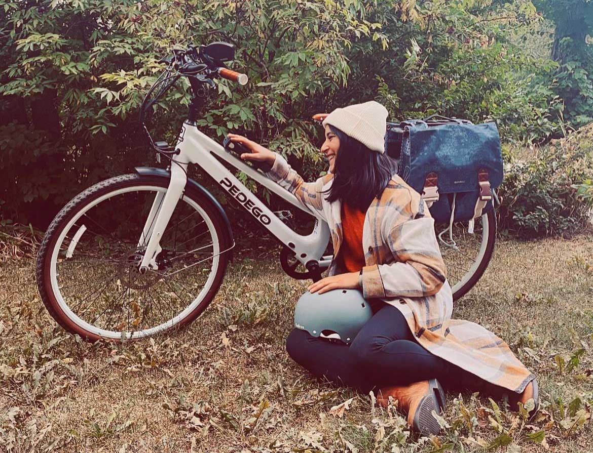 Naomi-YEGConnector-Pedego-Canada-Commuting Woman romantic pose with Pedego ebike.