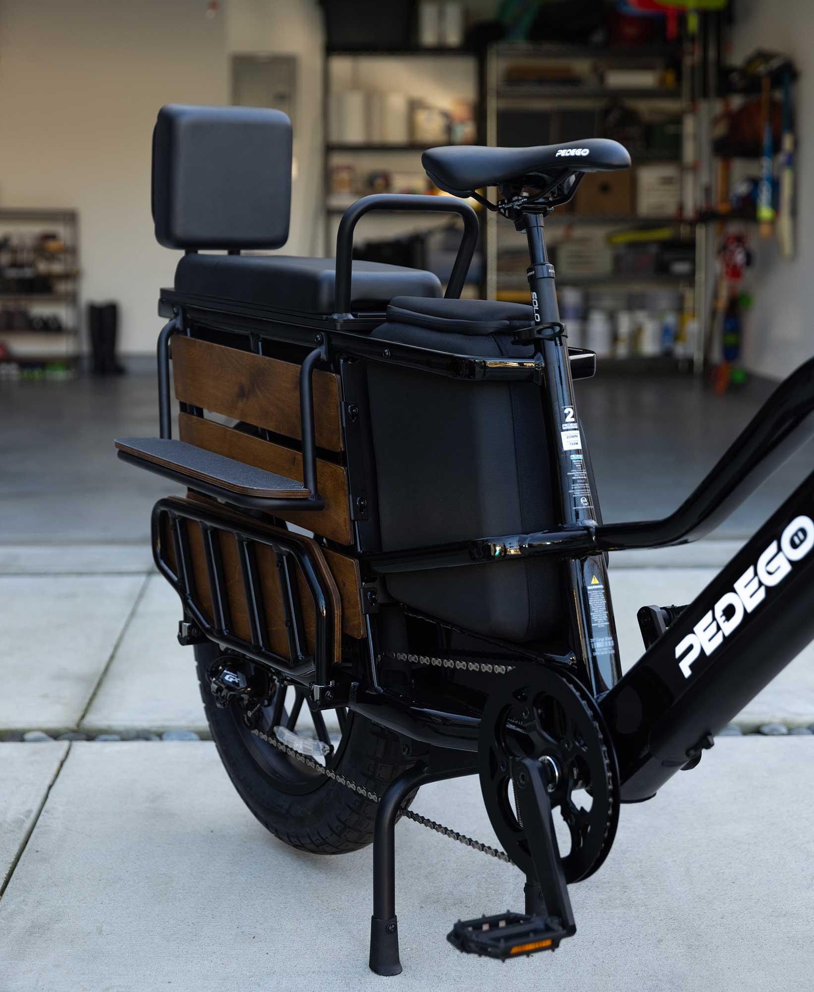 Pedego-Canada-Cargo-Ebike-Lifestyle-Garage Pedego Cargo Ebike parked outside home with garage door open